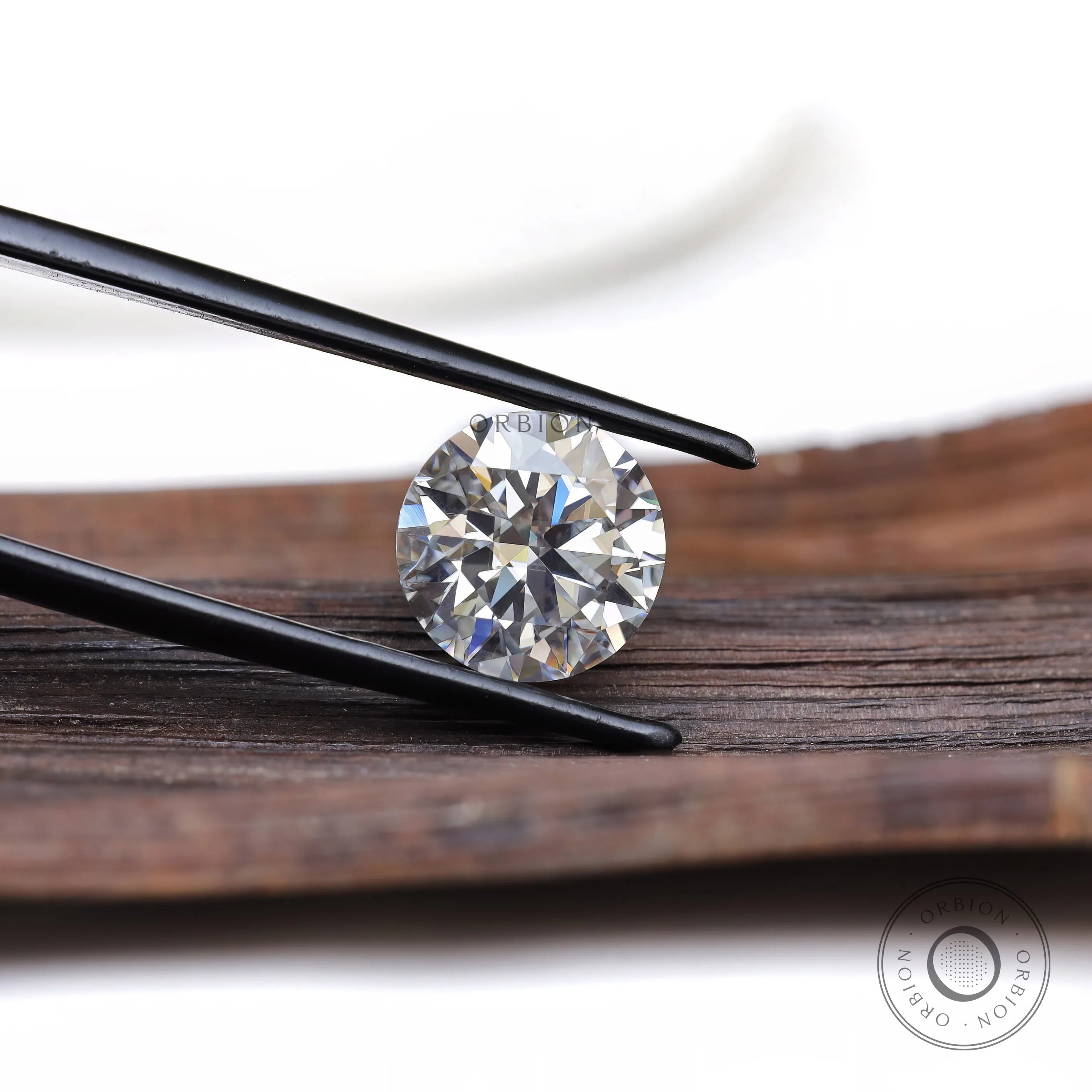 Loose round moissanite stone close-up brilliance view