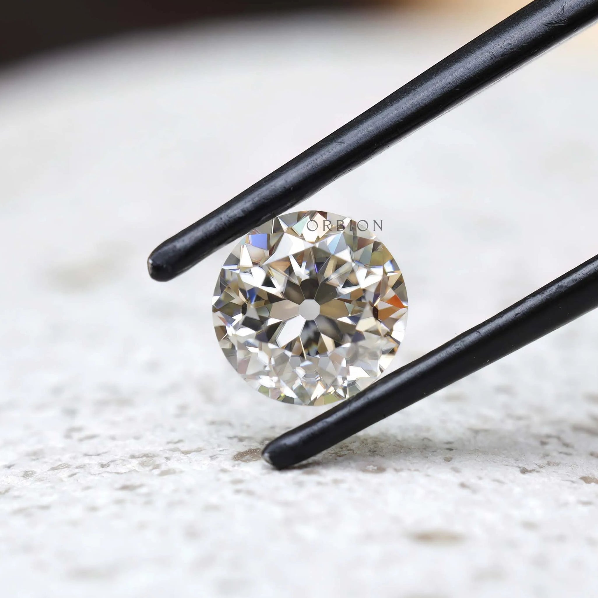 1.40 ct Loose off white moissanite with classic OEC round shape