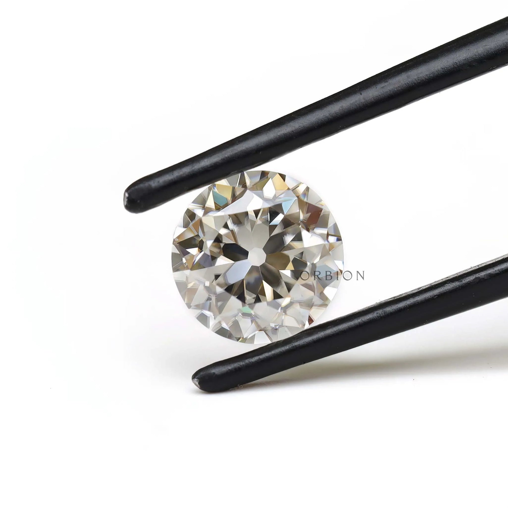 Vintage style round moissanite 1.40 ct in soft off white color