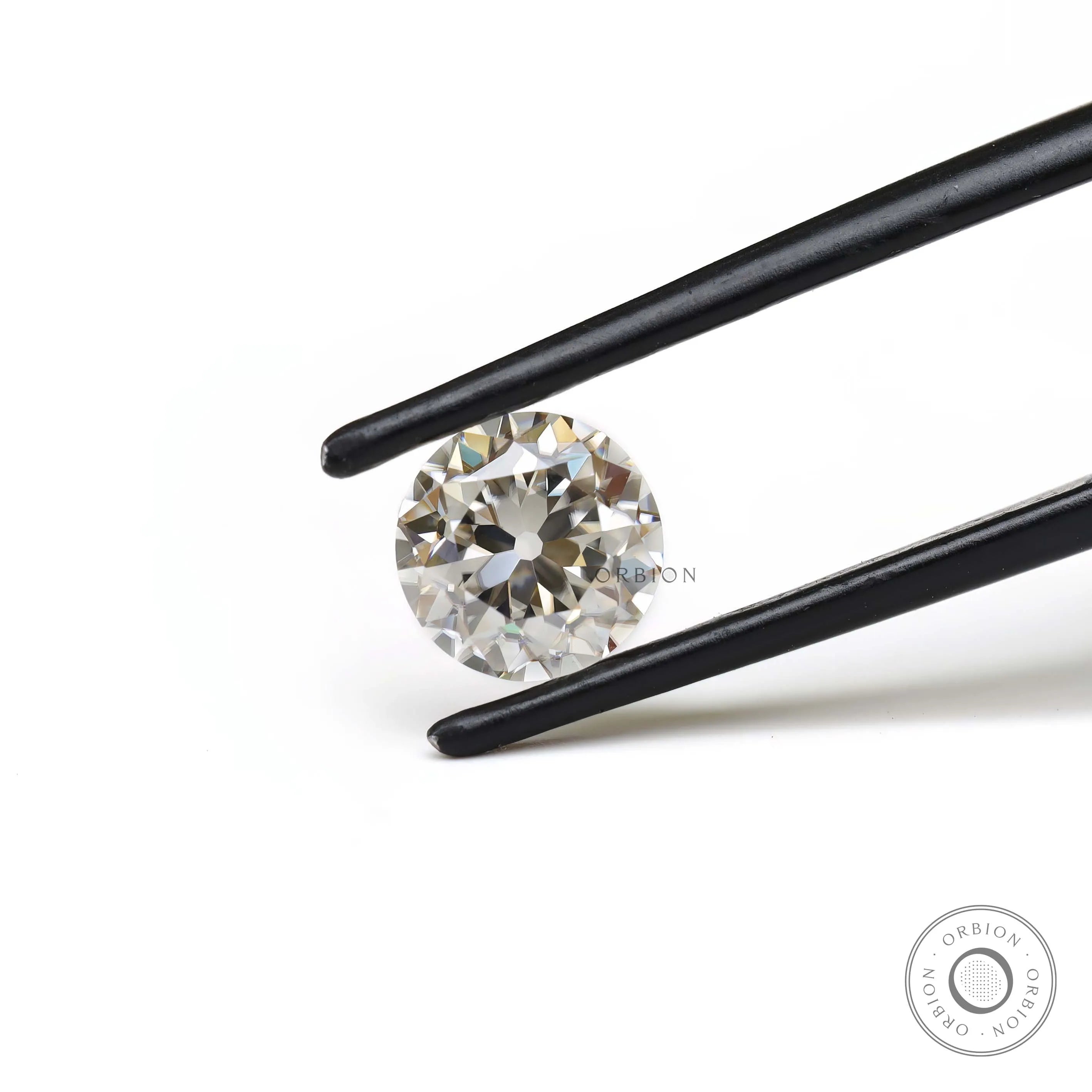 Vintage style round moissanite 1.40 ct in soft off white color