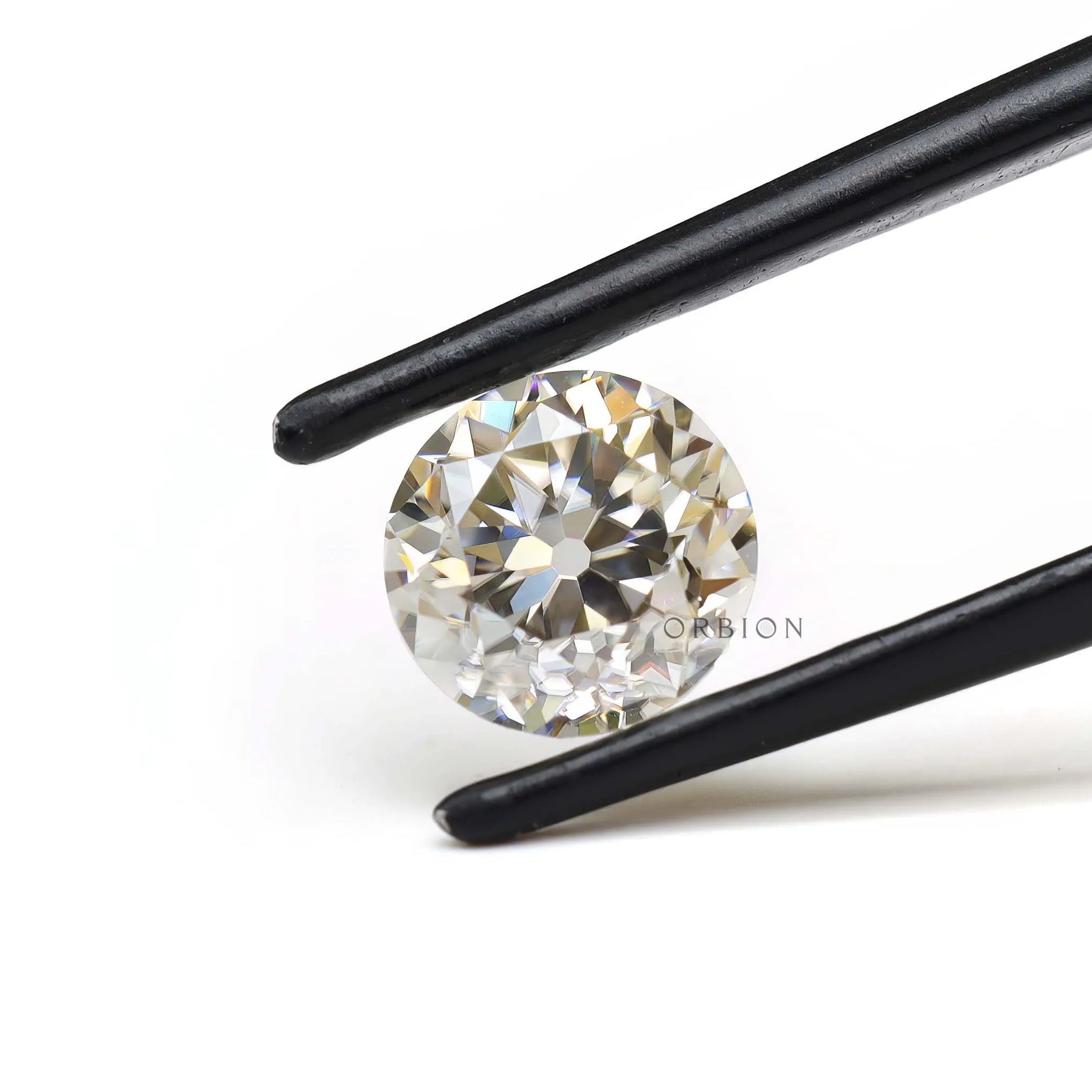 1.40 ct Round moissanite with subtle off white brilliance loose stone