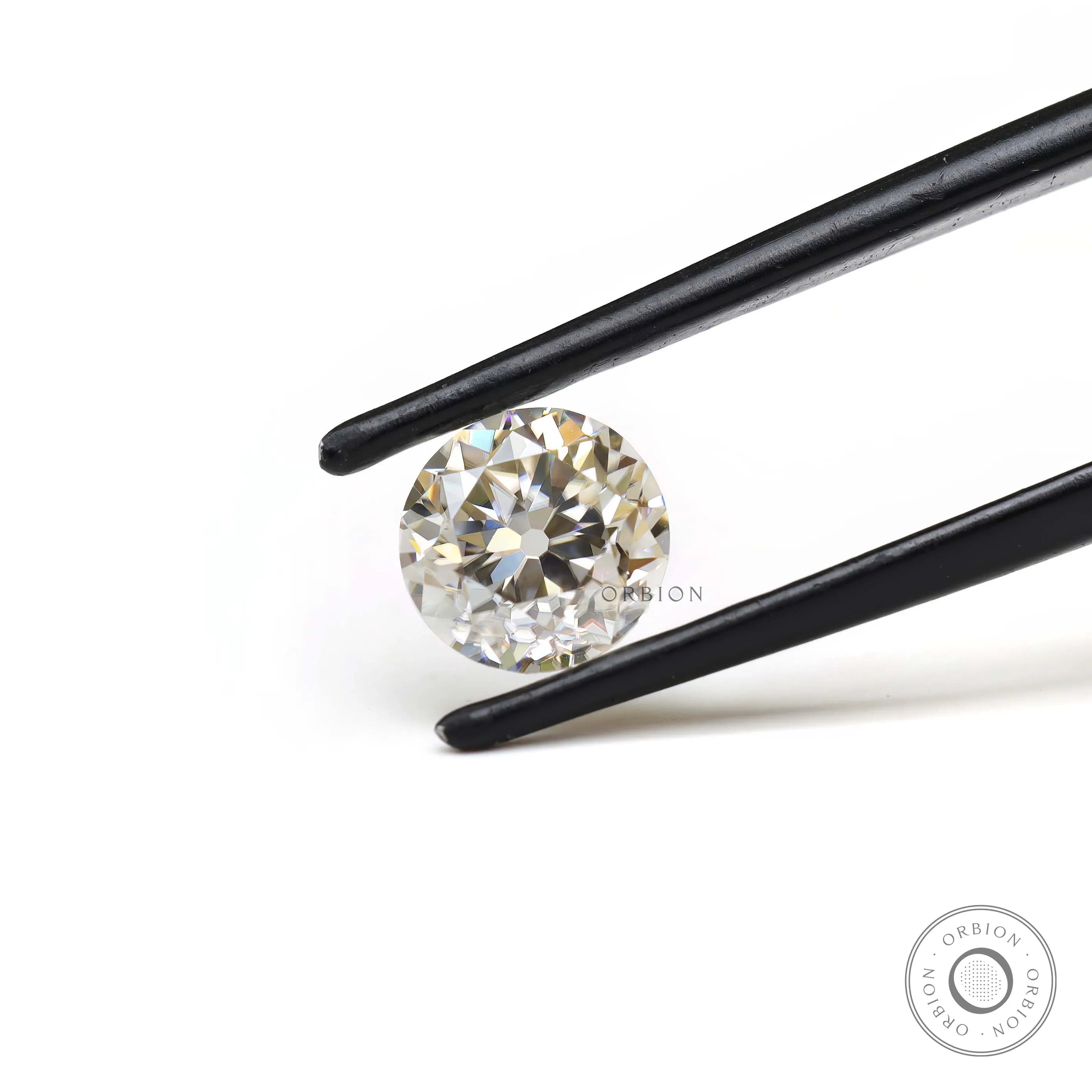 1.40 ct Round moissanite with subtle off white brilliance loose stone