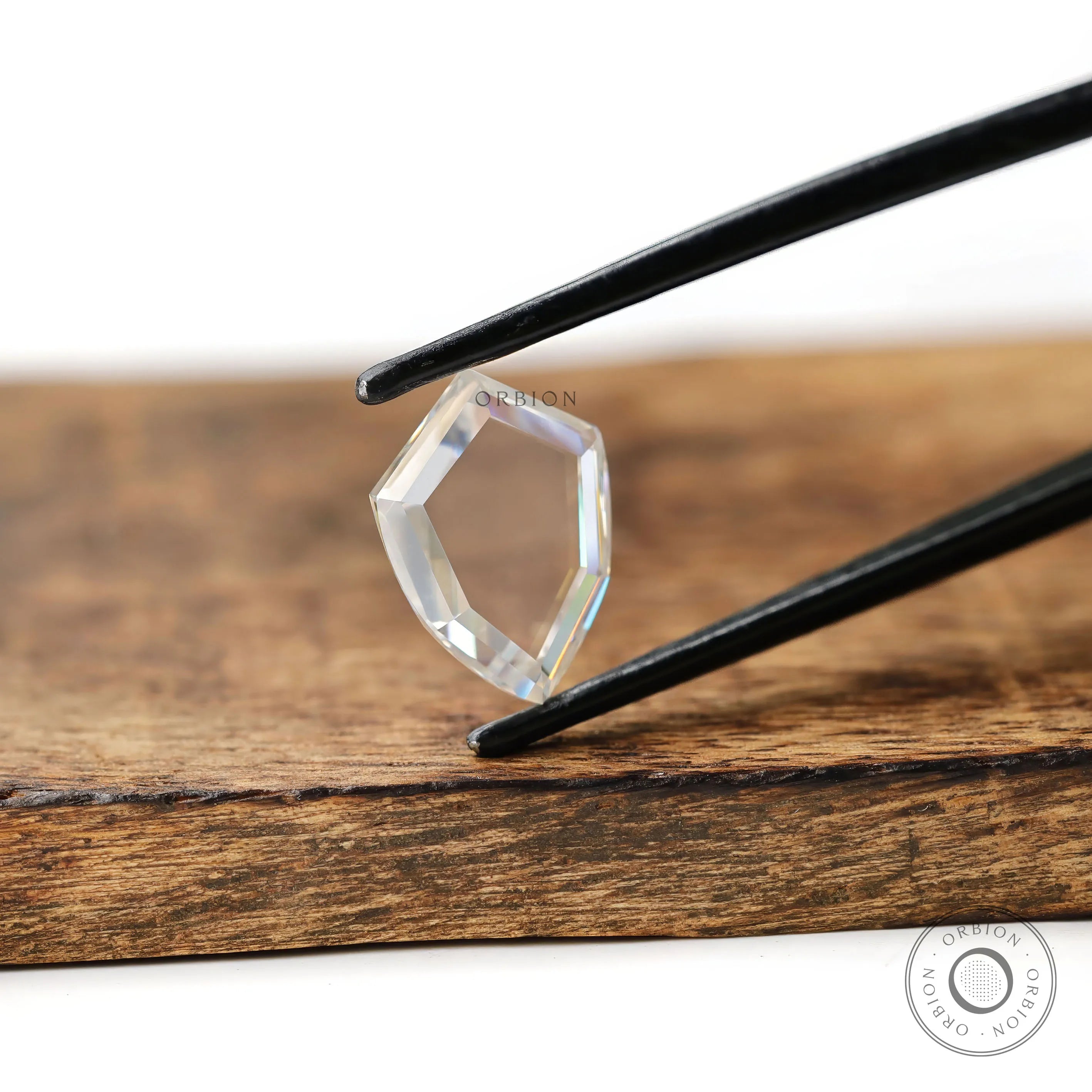 Colorless moissanite shield shape portrait cut stone
