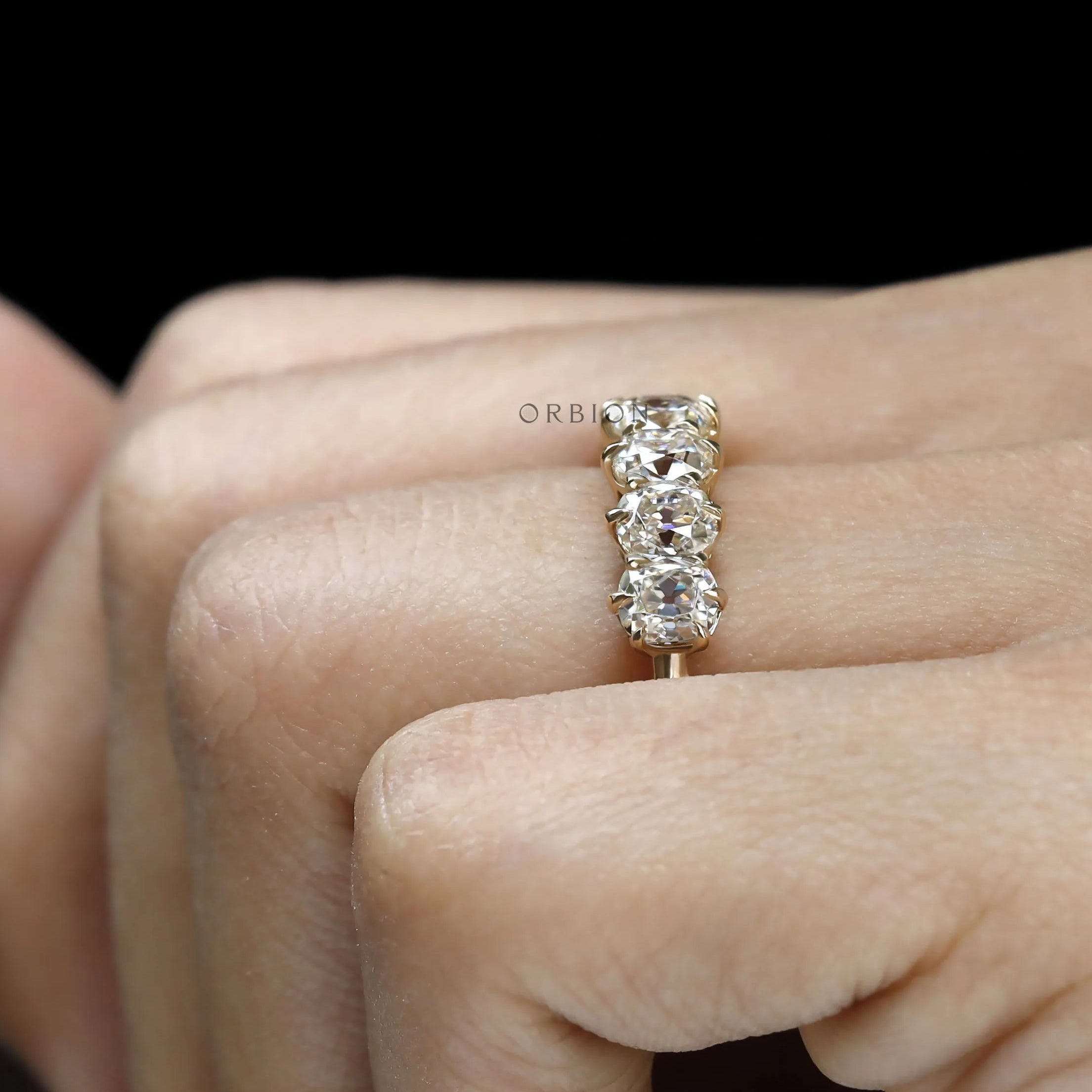 Vintage-inspired seven stone cushion moissanite wedding band, old mine cut, yellow gold half eternity ring