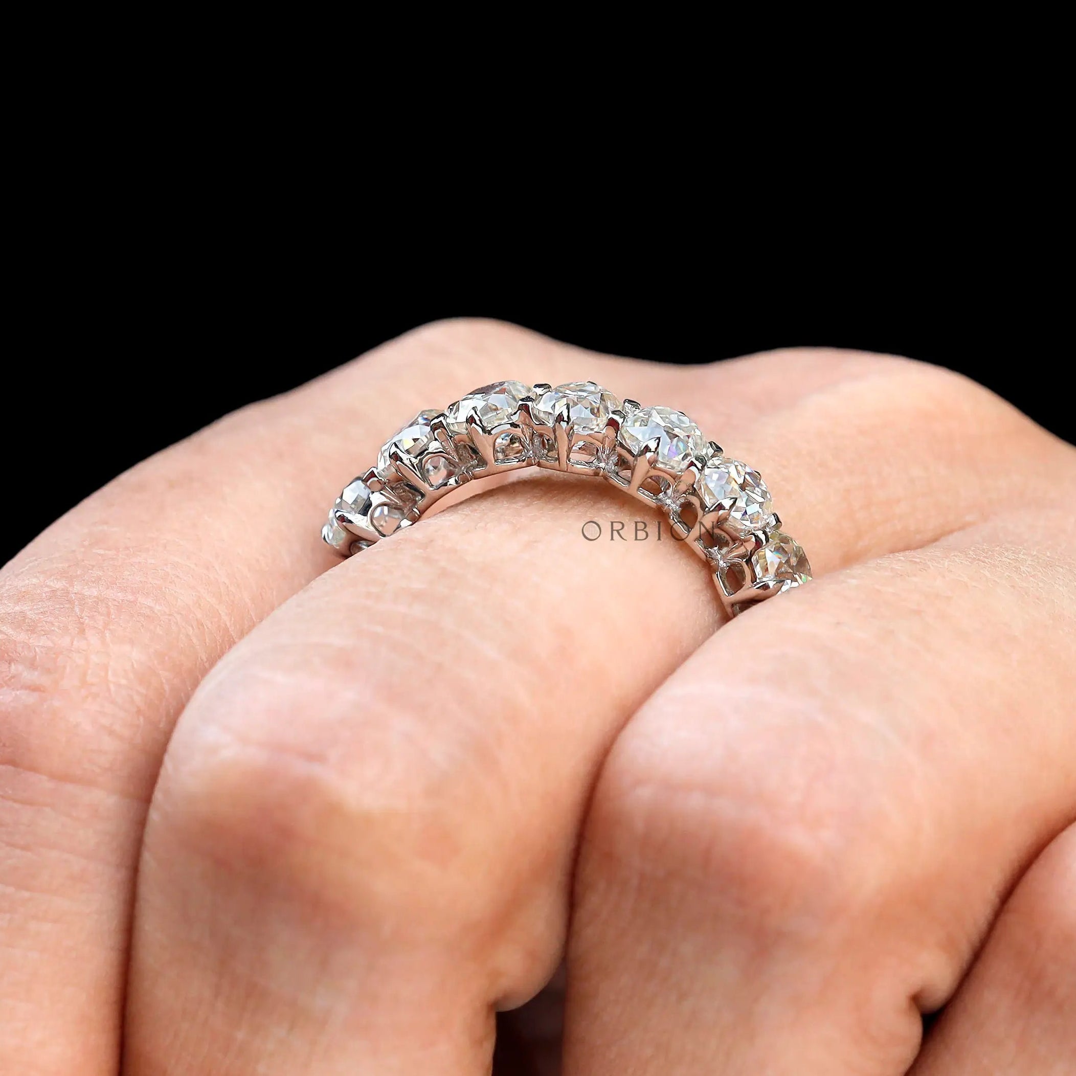 White gold old mine cut cushion moissanite ring on hand