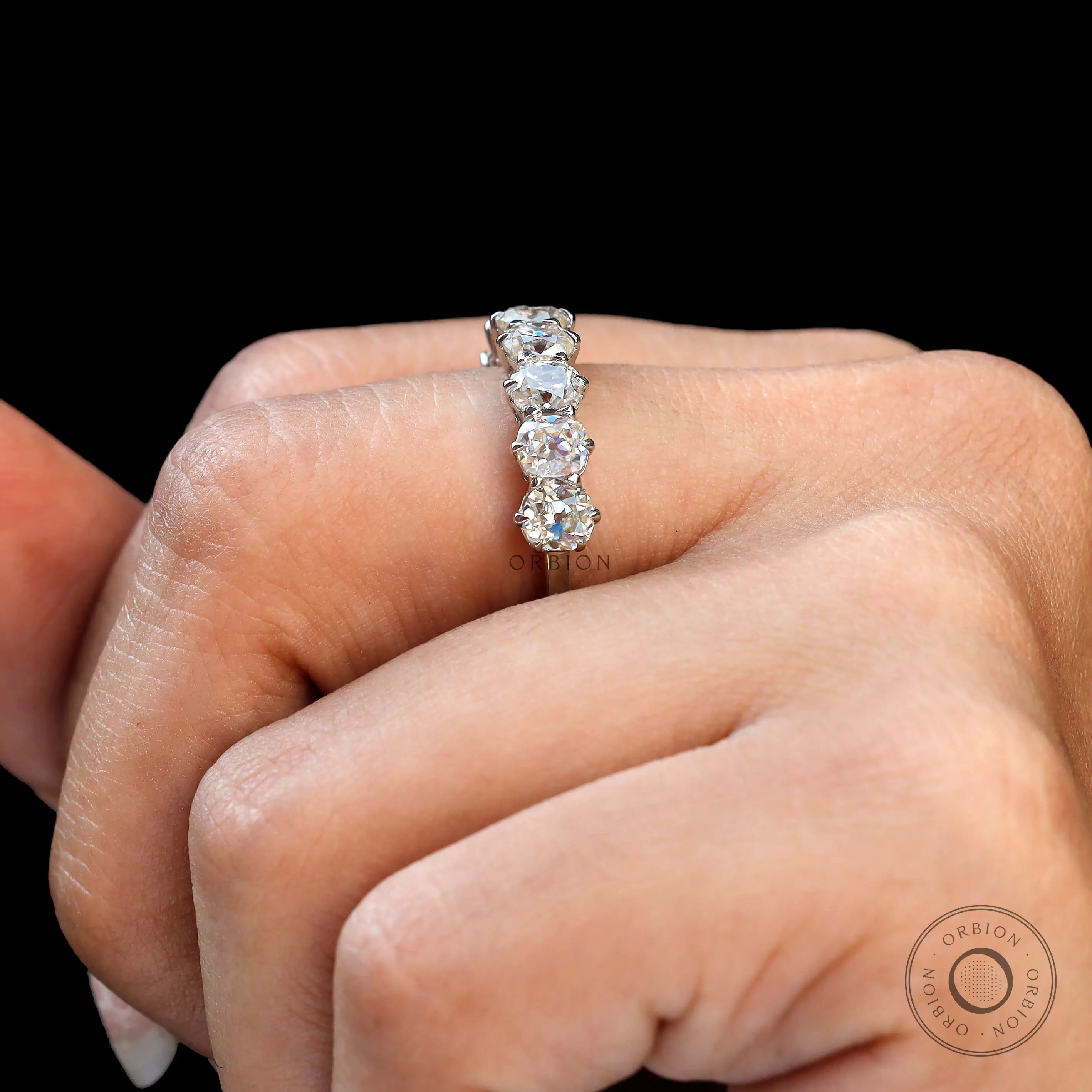 Cushion cut old mine moissanite wedding band on fingure