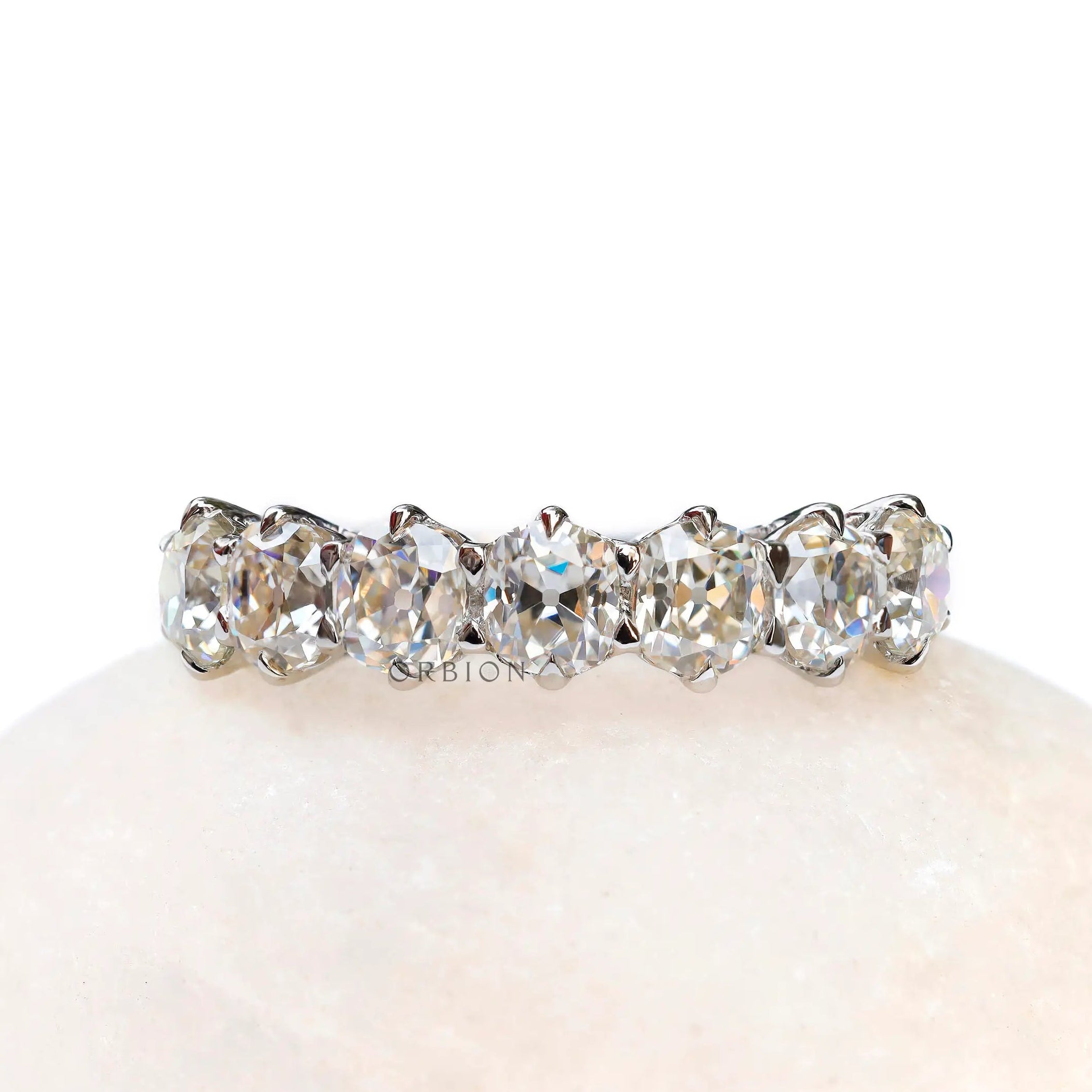 Seven stone old mine cut cushion moissanite wedding band in white gold