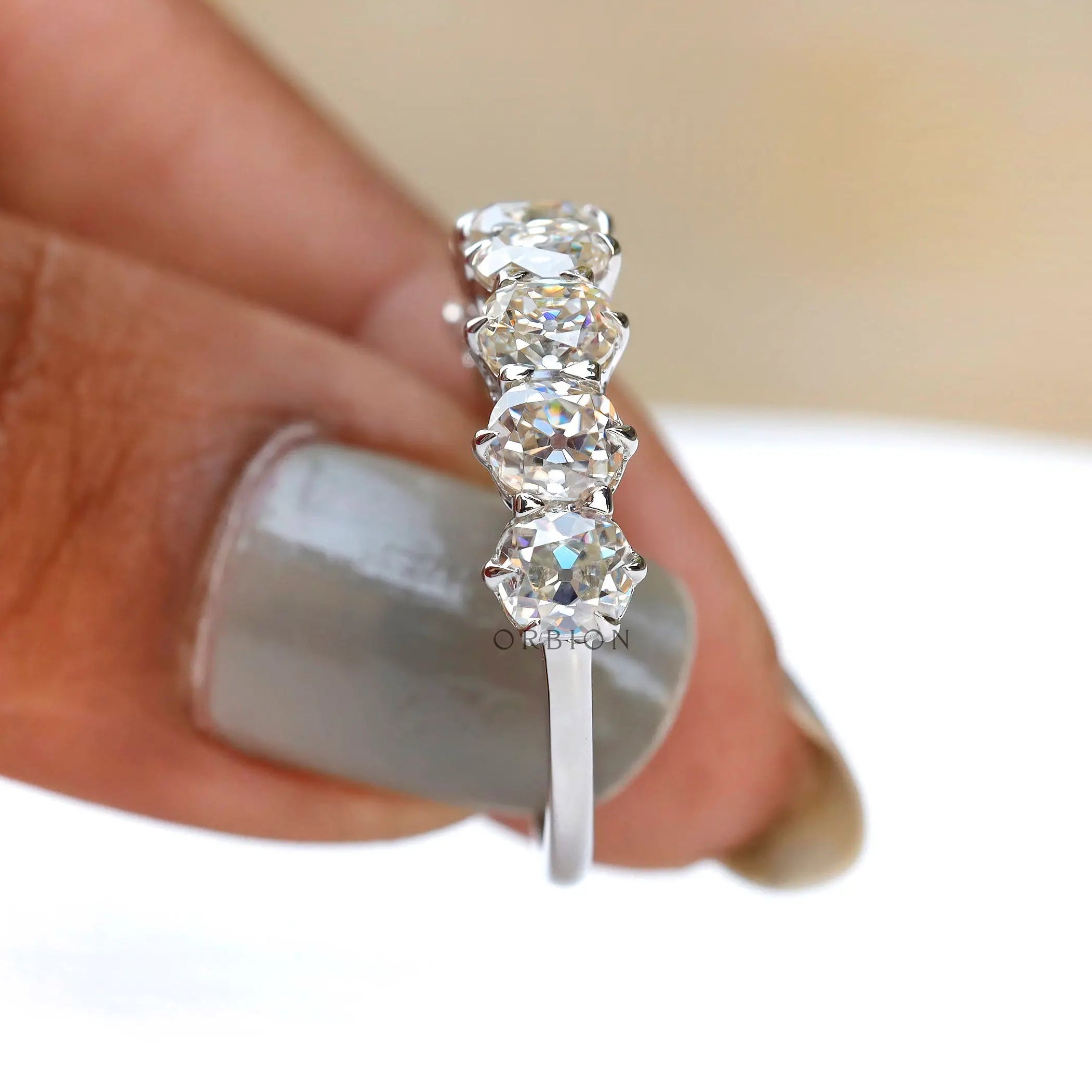Elegant seven stone wedding band in 14K white gold