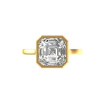 Top view Asscher cut solitaire framed in sharp bezel in yellow gold.