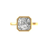 Top view Asscher cut solitaire framed in sharp bezel in yellow gold.