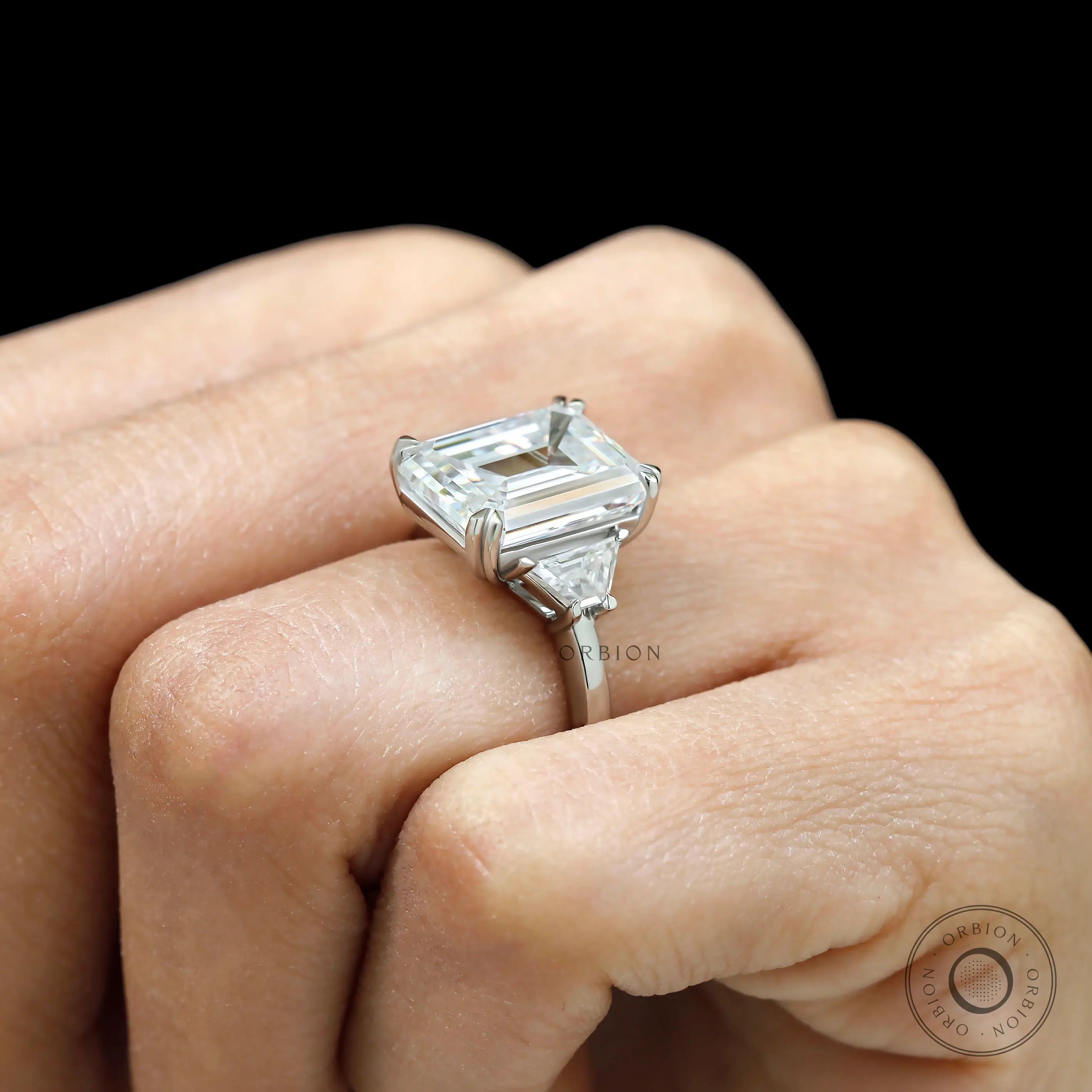 Emerald cut engagement ring detail showing step cut facets