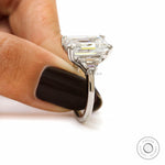 Classic emerald cut step cut engagement ring with side trapezoids