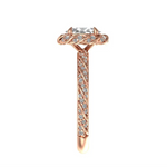 Vintage style oval halo engagement ring with twisted diamond band