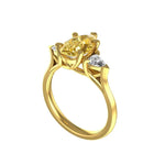 Dark champagne pear moissanite ring with trillion side stones