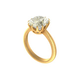 Angled view of cushion solitaire with crown prongs and brushed band