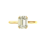 Front View of Emerald cut hybrid moissanite solitaire ring, twin claw prongs, yellow gold.