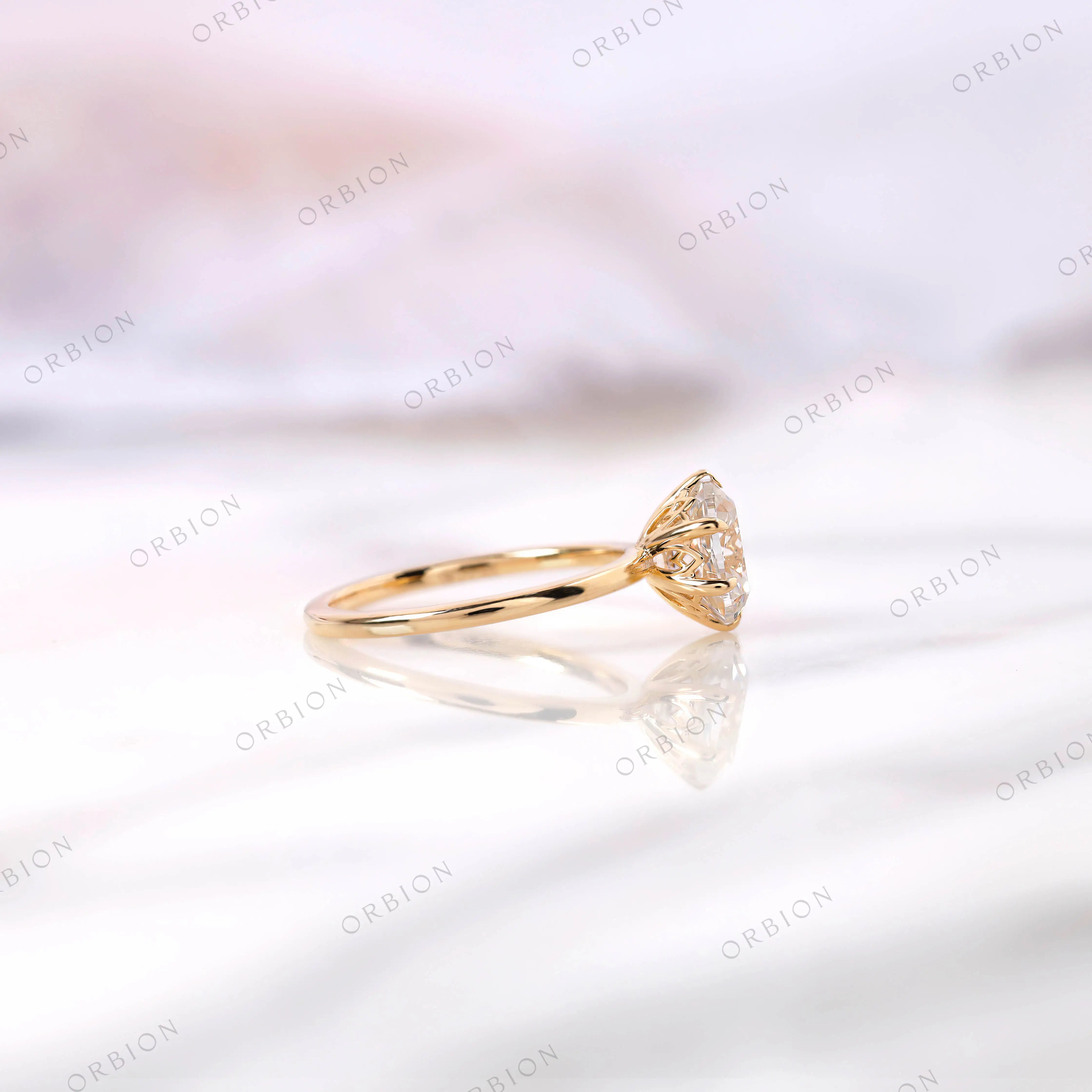 Slim band old mine cut moissanite solitaire ring close up