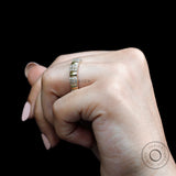 Women’s thick eternity wedding band worn on hand