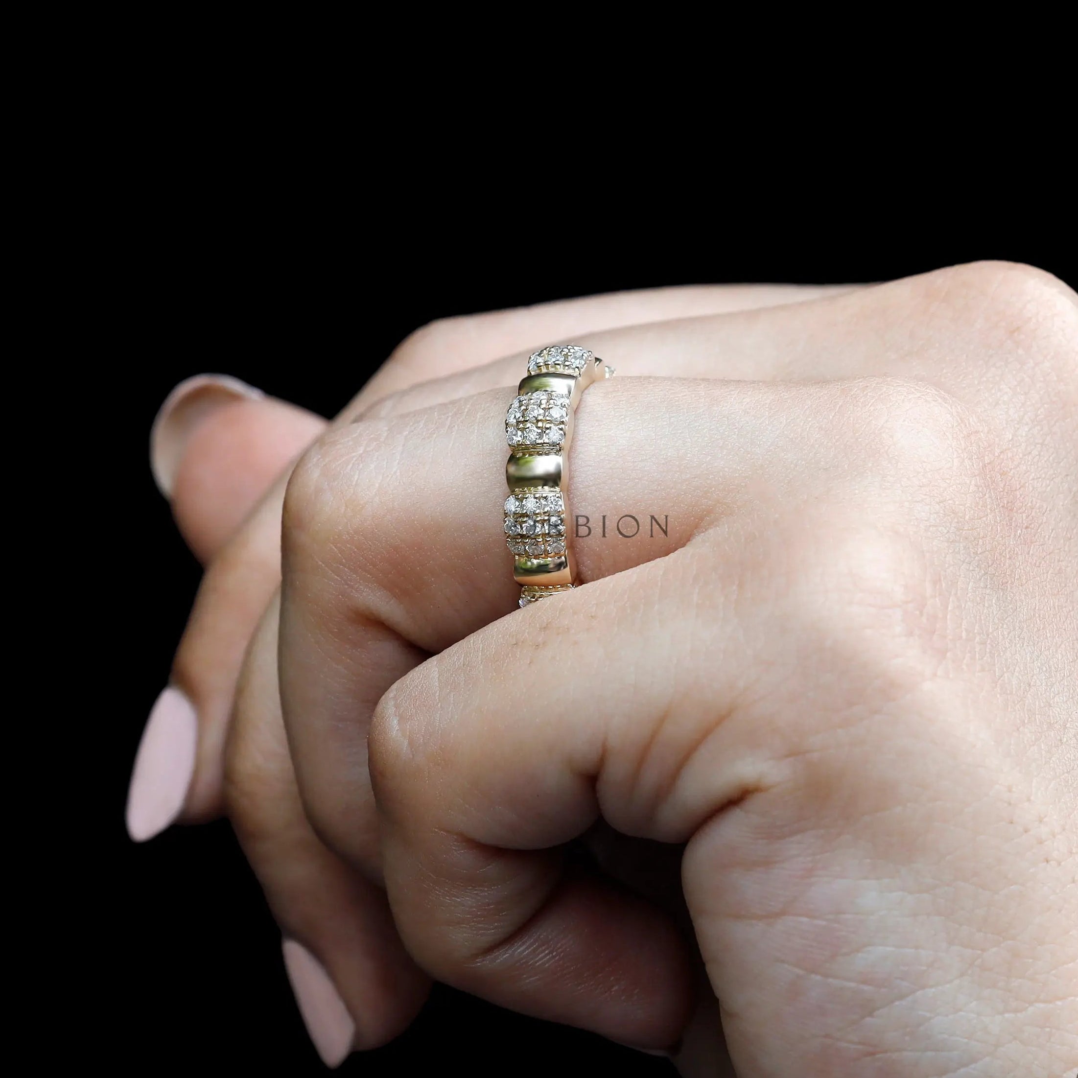 Women’s thick eternity wedding band worn on hand