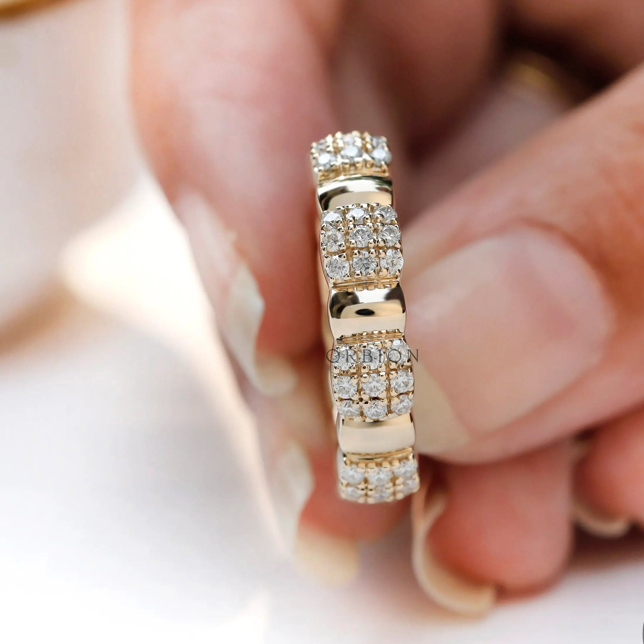 Wide yellow gold anniversary band with continuous sparkle
