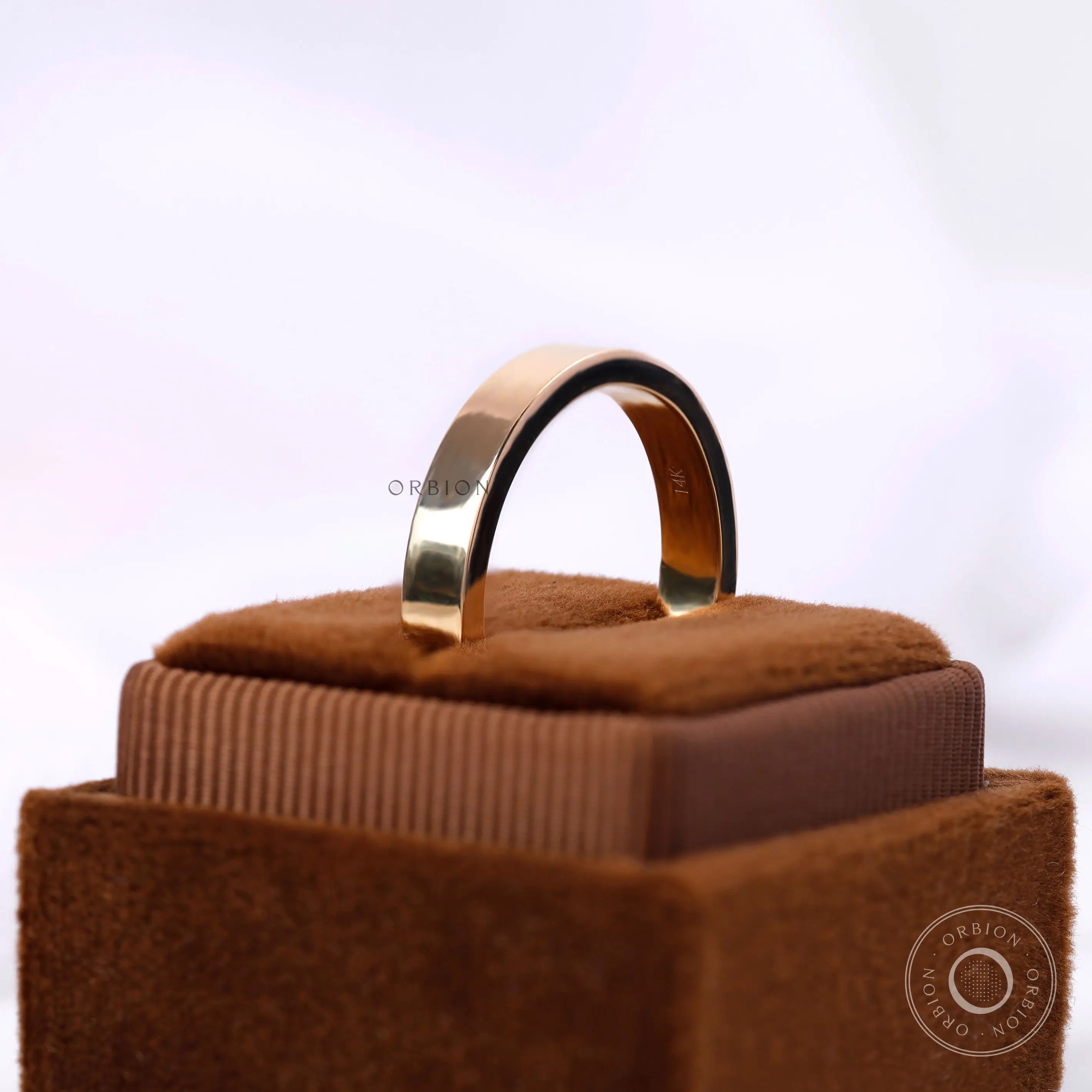 Angled view flat gold comfort fit ring