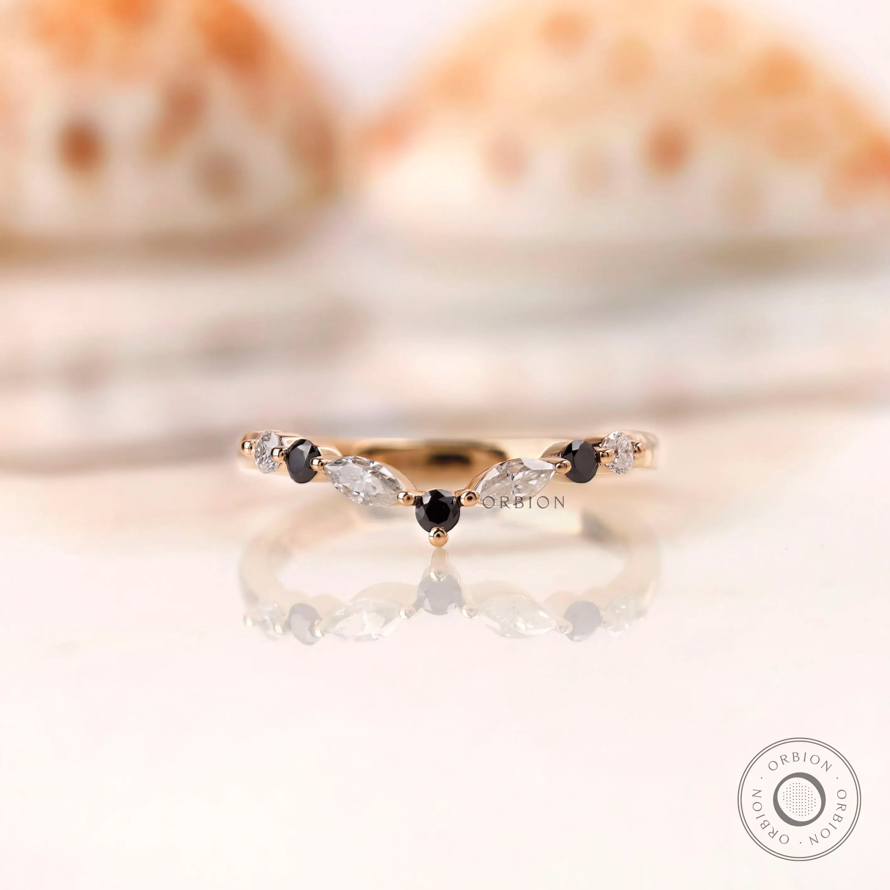 Front view of V chevron band with black and white moissanite