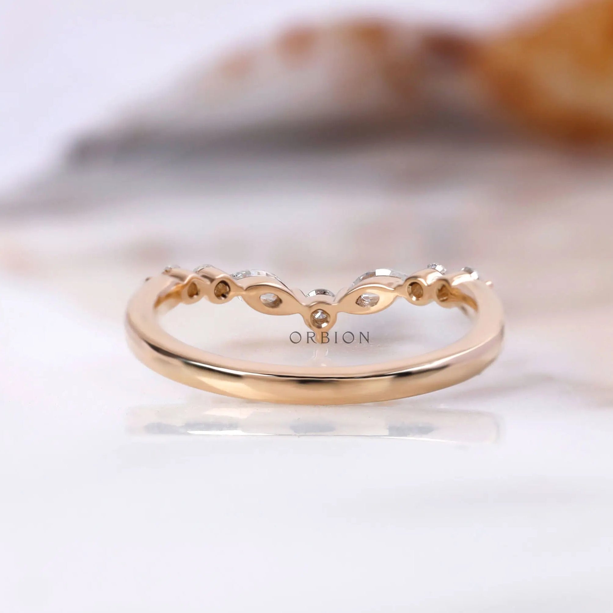 Back view of V-shaped half eternity moissanite band
