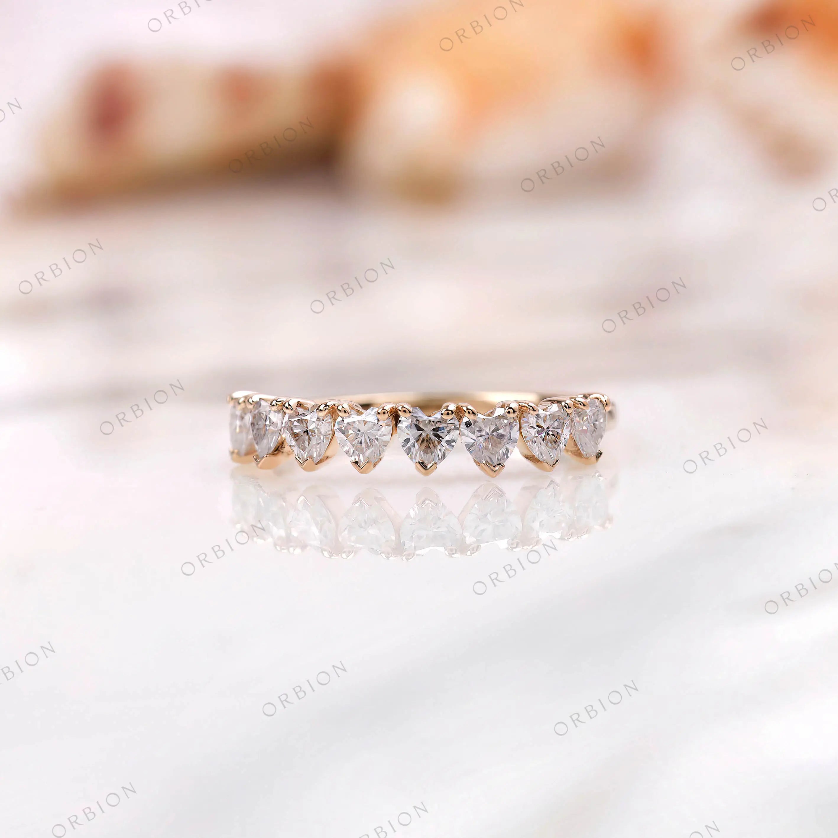 Heart shape half eternity band in yellow gold, straight-on sparkle view