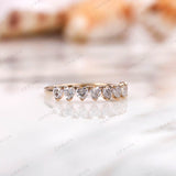 Heart half eternity wedding band, angled side view in yellow gold