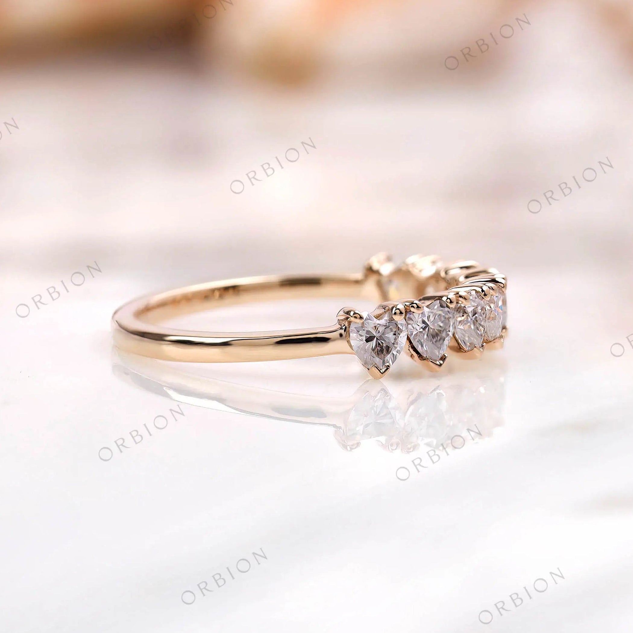Low profile heart band, side view showing prong setting and slim shank