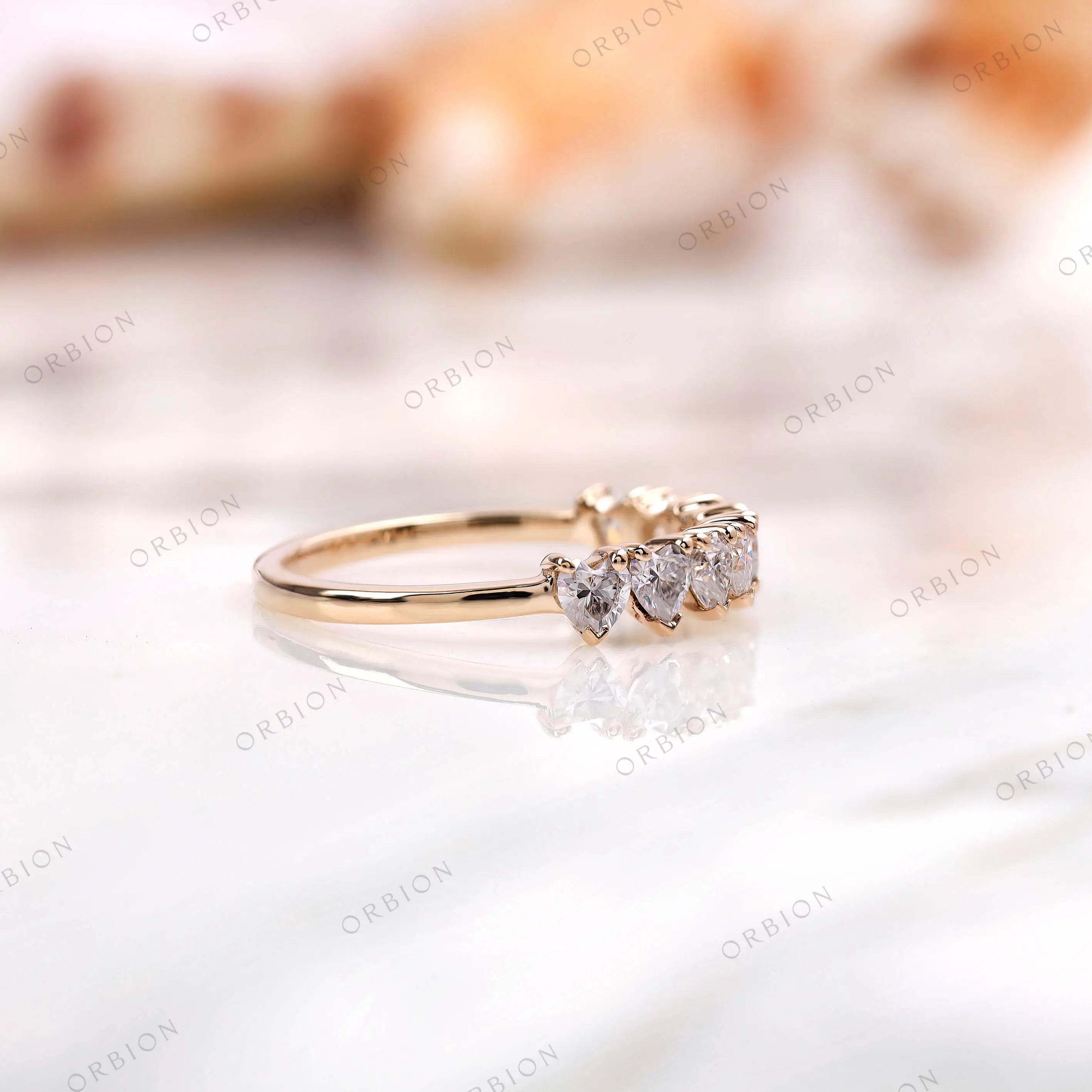 Low profile heart band, side view showing prong setting and slim shank