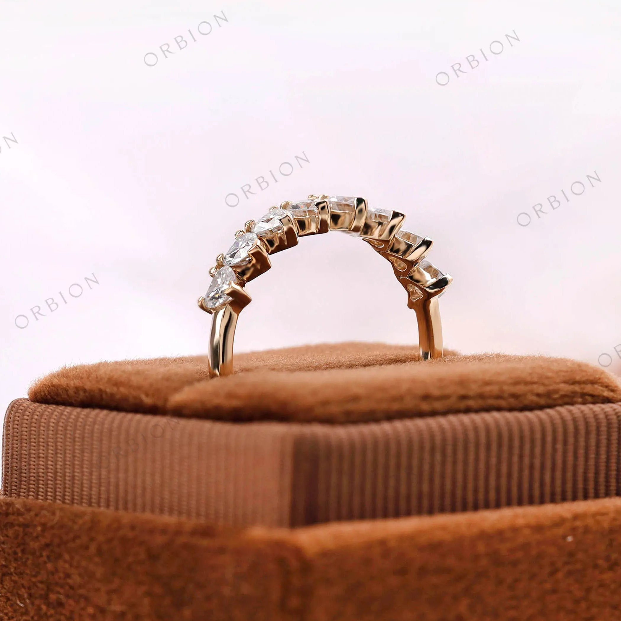 Heart shaped stackable band, side profile displayed on brown jewelry box