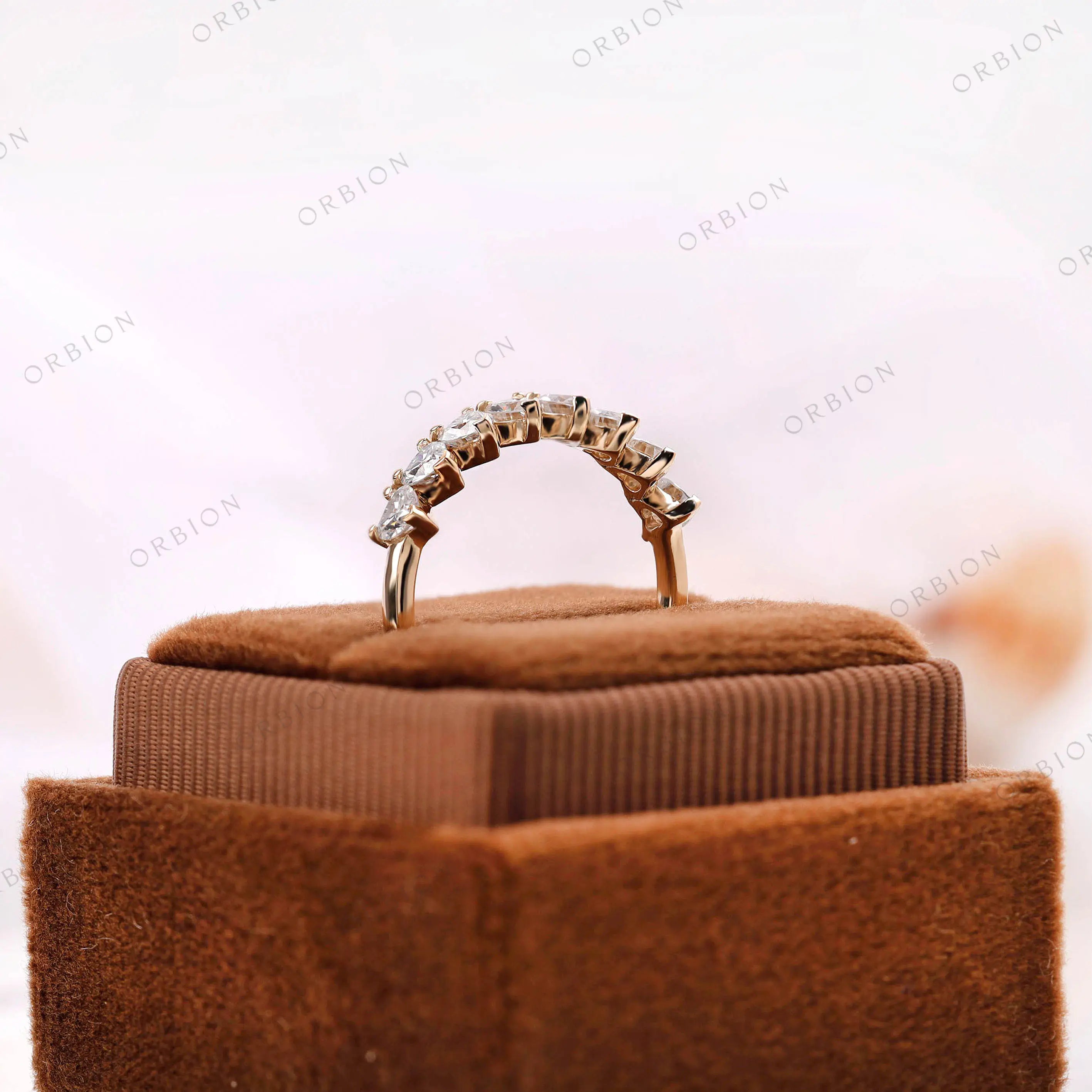 Heart shaped stackable band, side profile displayed on brown jewelry box