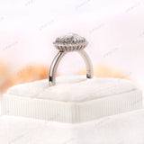 Close-up of Moissanite Halo Ring in 10K White Gold with Round Rose Cut Center Stone and Polished Finish.