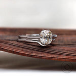 Old mine cut cushion solitaire ring set side view
