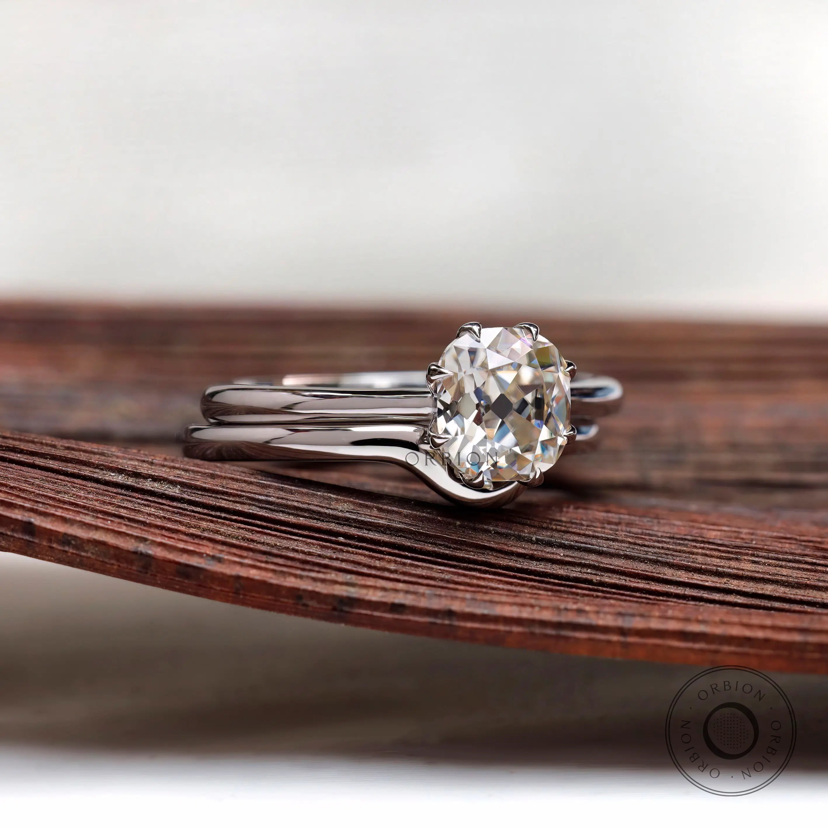 Old mine cut cushion solitaire ring set side view