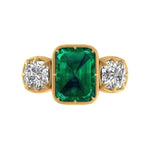 Vintage emerald cut green moissanite three stone engagement ring in 14k yellow gold