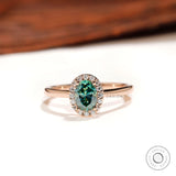 Blue green oval moissanite halo engagement ring top view