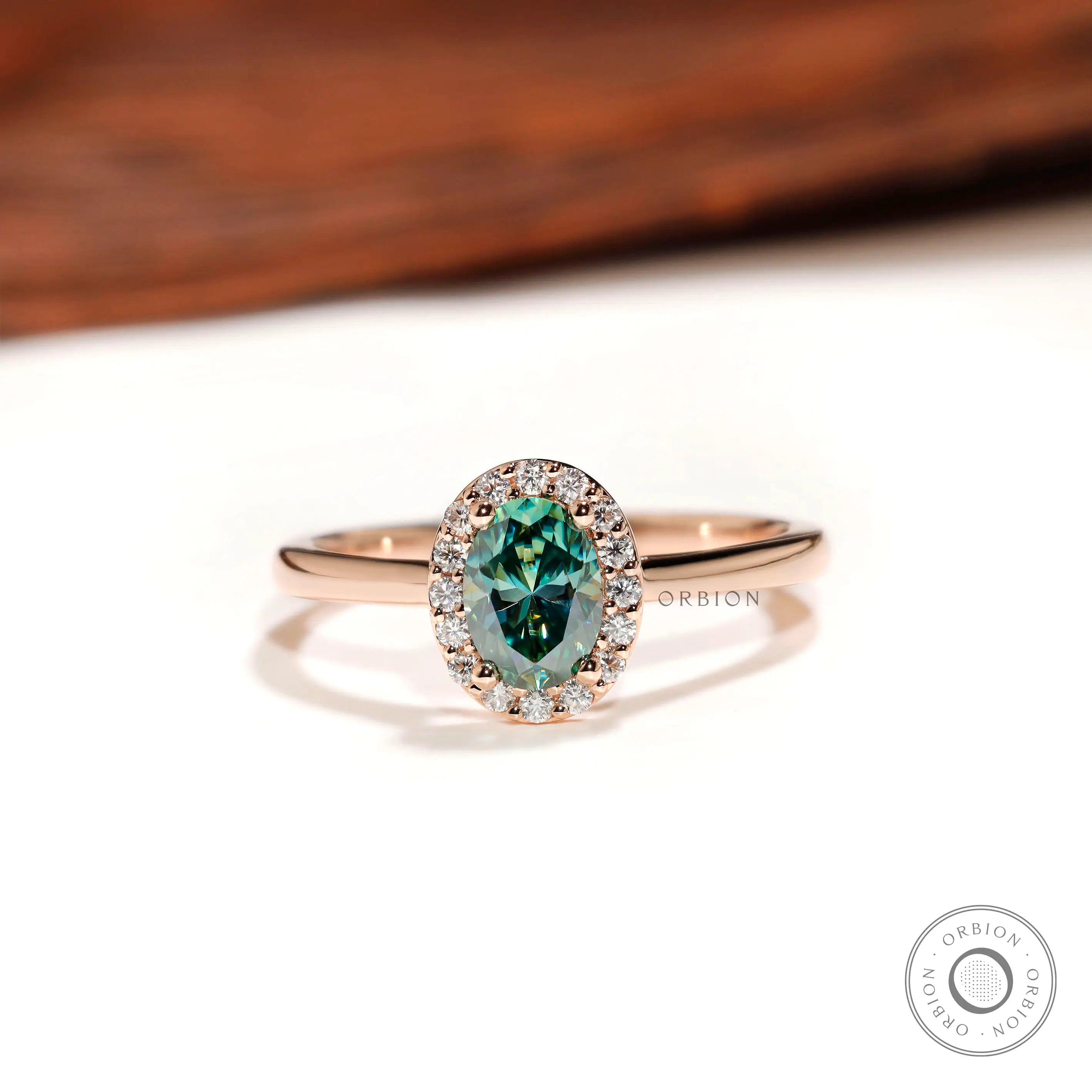 Blue green oval moissanite halo engagement ring top view
