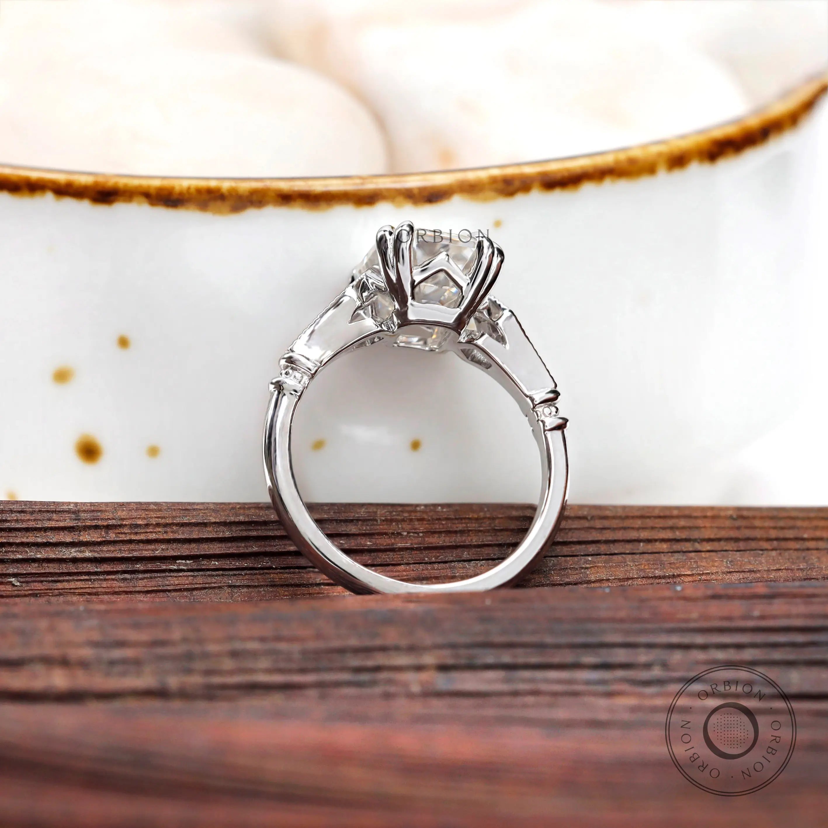 Art deco inspired emerald cut engagement ring