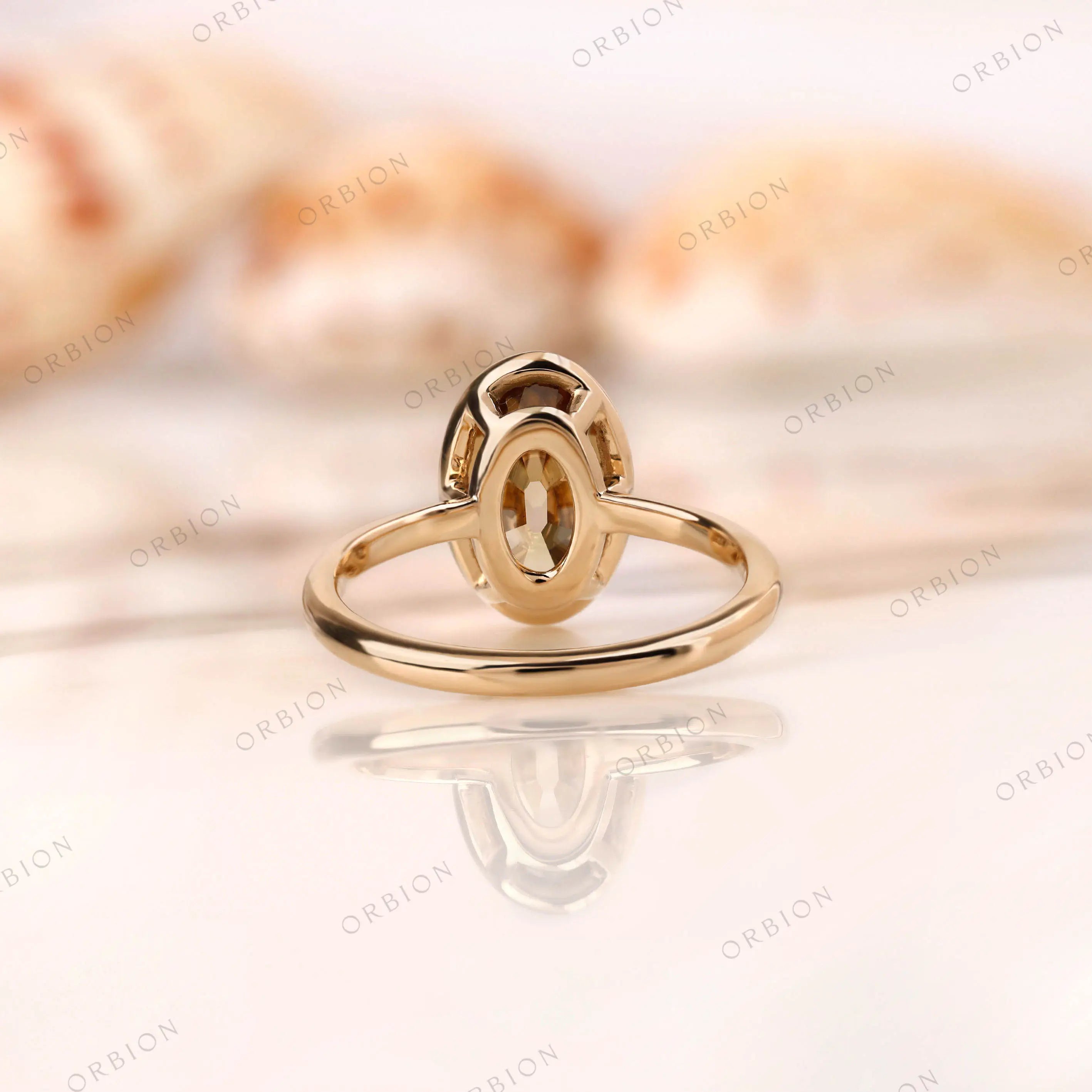 Back view of oval dark champagne moissanite ring bezel structure