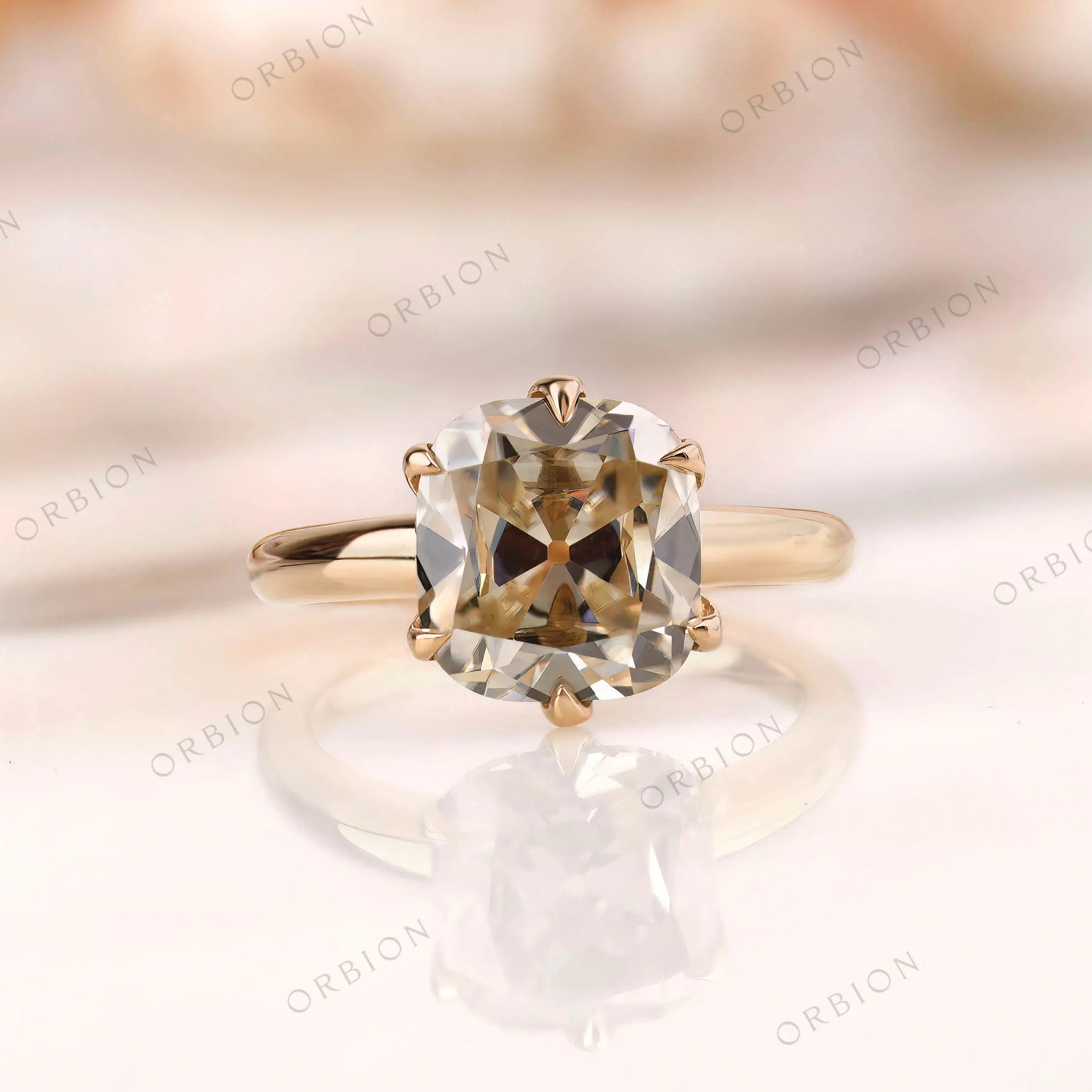 Elongated cushion Old Mine cut moissanite solitaire ring in 14K yellow gold front view