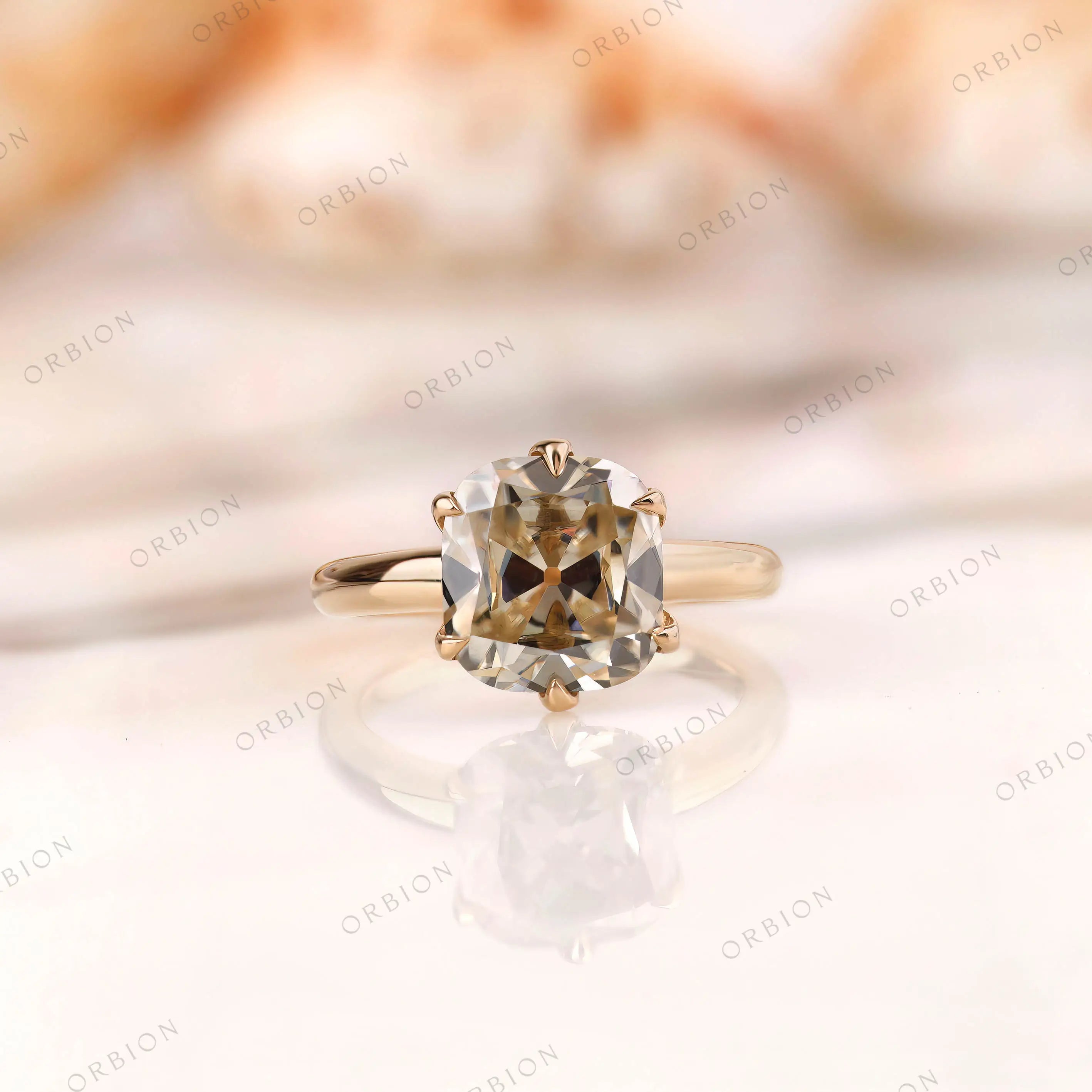 Elongated cushion Old Mine cut moissanite solitaire ring in 14K yellow gold front view