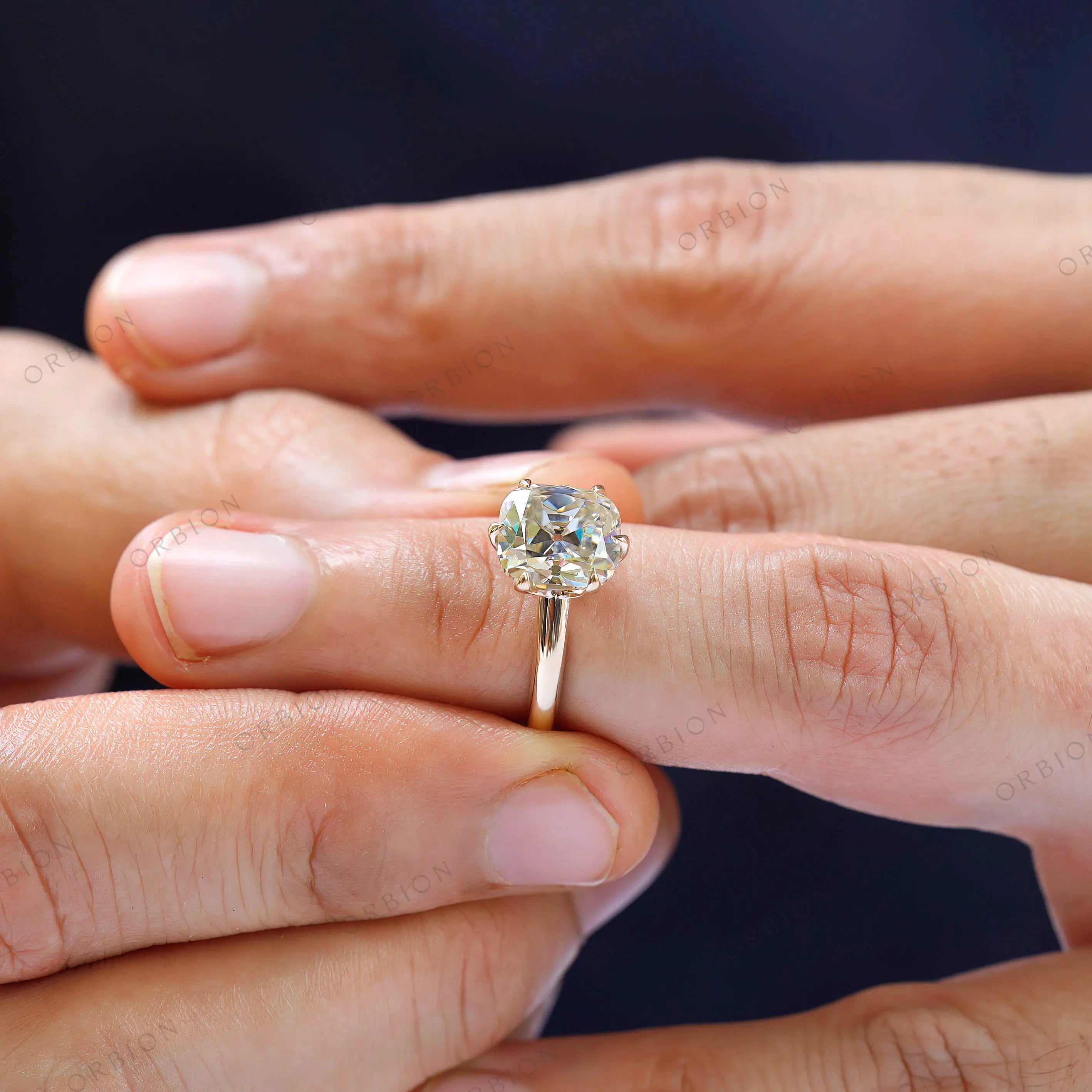 High polish yellow gold band with moissanite center stone