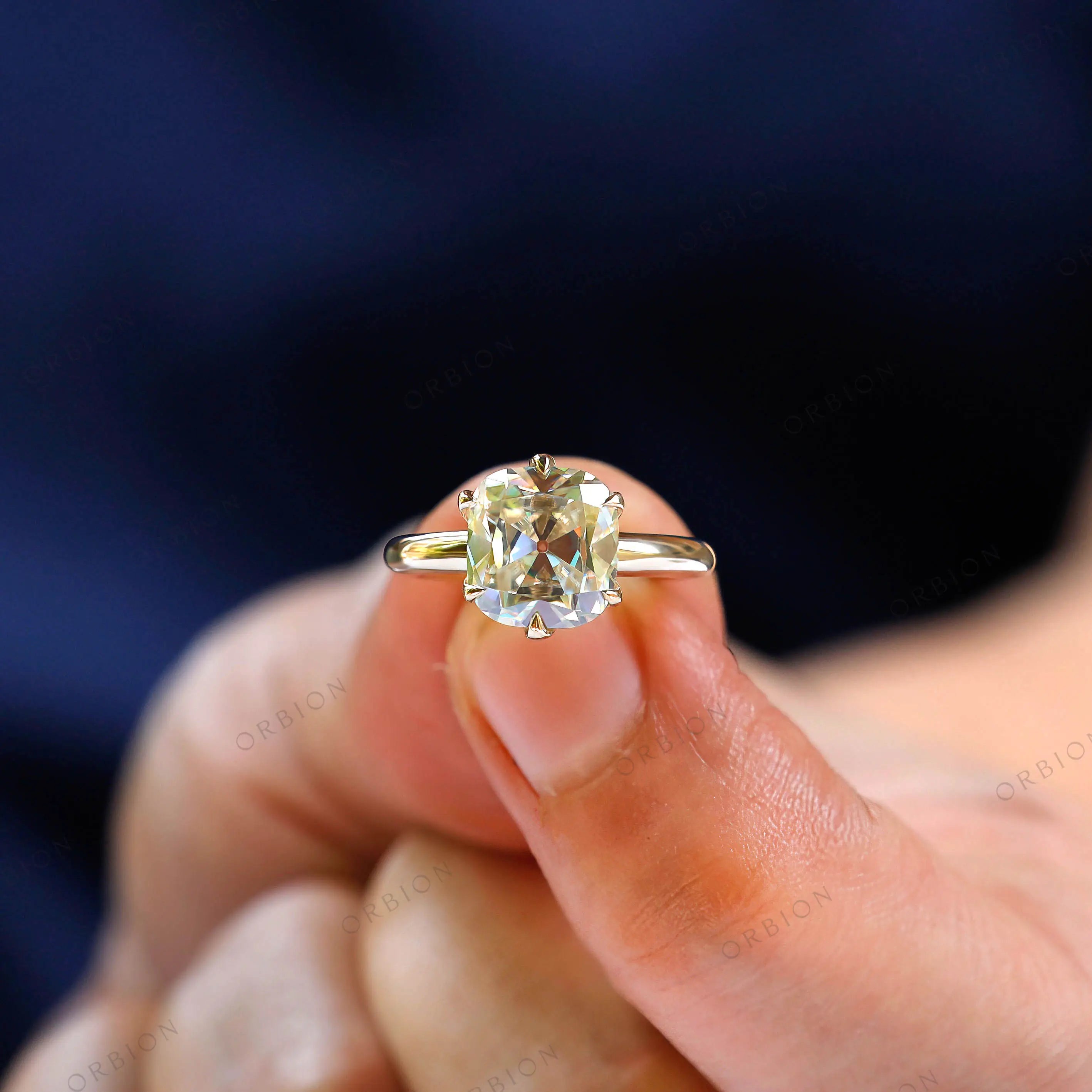 Elegant elongated cushion Old Mine cut engagement ring lifestyle image