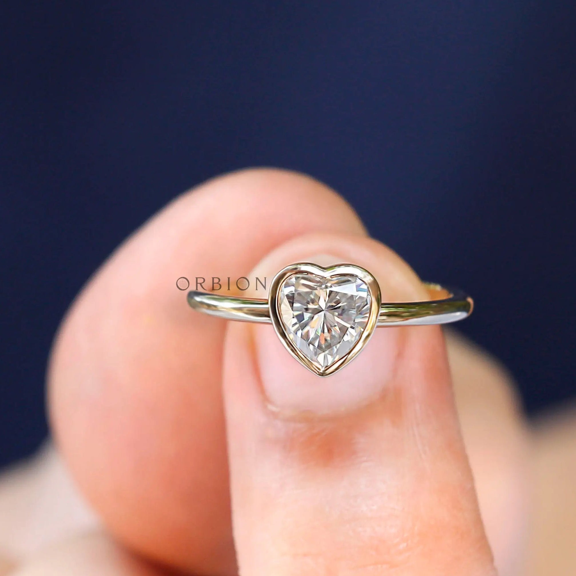 Closed bezel heart solitaire ring yellow gold