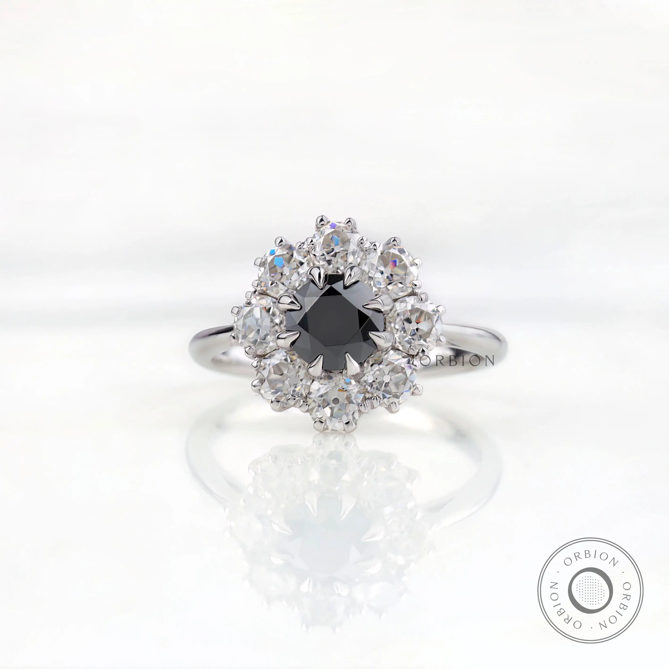 Front view vintage cluster halo ring with black moissanite center stone.