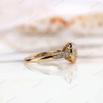 Side view of Bezel Set Cushion Cut Moissanite Engagement Ring with Round Moissanite side stones