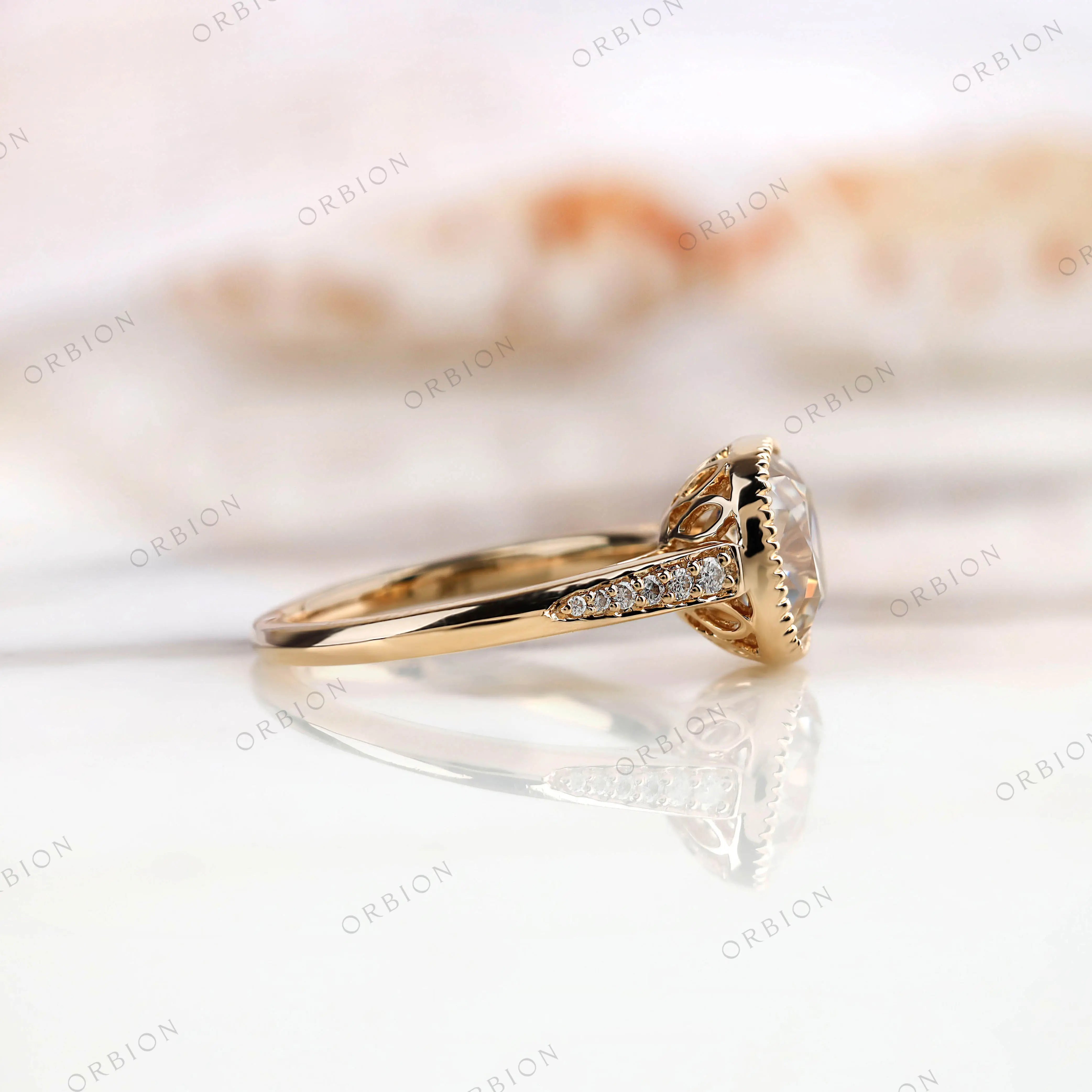 Side view of Bezel Set Cushion Cut Moissanite Engagement Ring with Round Moissanite side stones