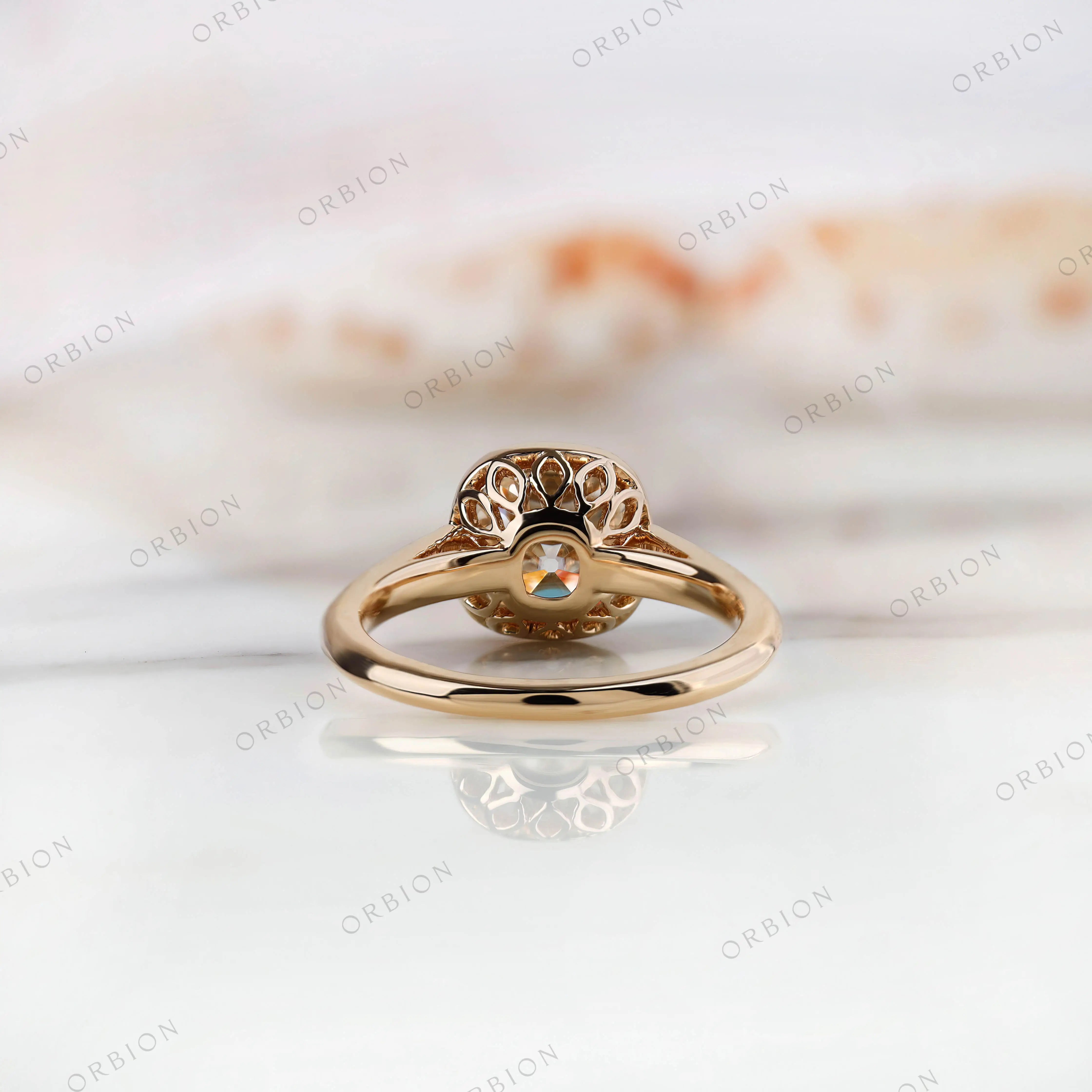 Back view of Bezel Set Cushion Cut Moissanite Engagement Ring with side stone detailing